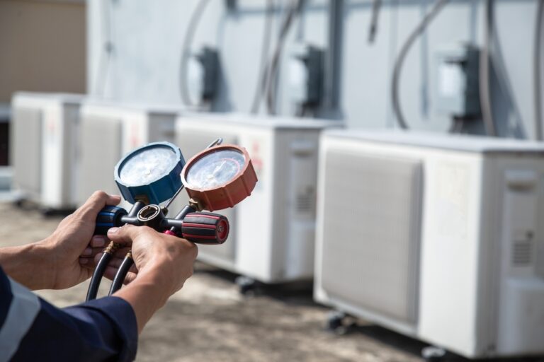 Air Temperature Professional technician checking an AC unit