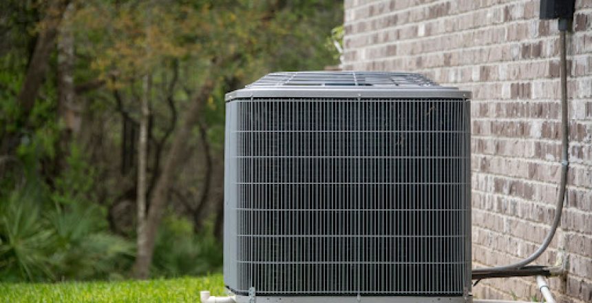 Outdoor AC unit next to a home.